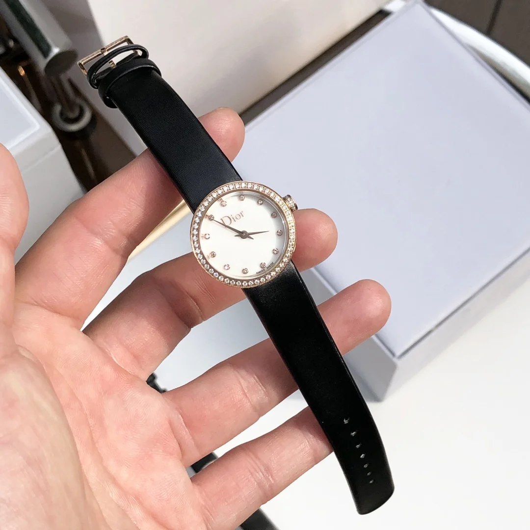 2 White mother-of-pearl dial set with 12 diamond hour markers