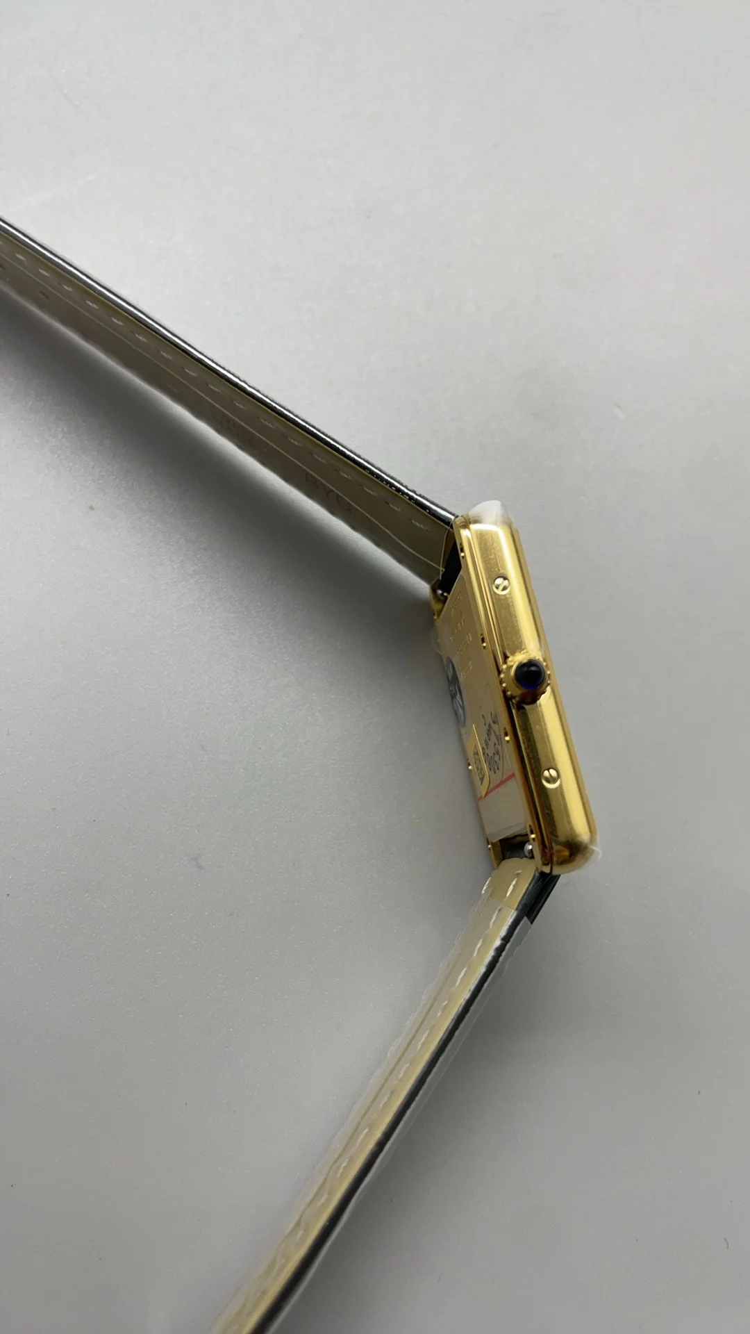AF, leather strap, medium size, 33.7*25.5mm, golden gray leather — photographed off the sweep