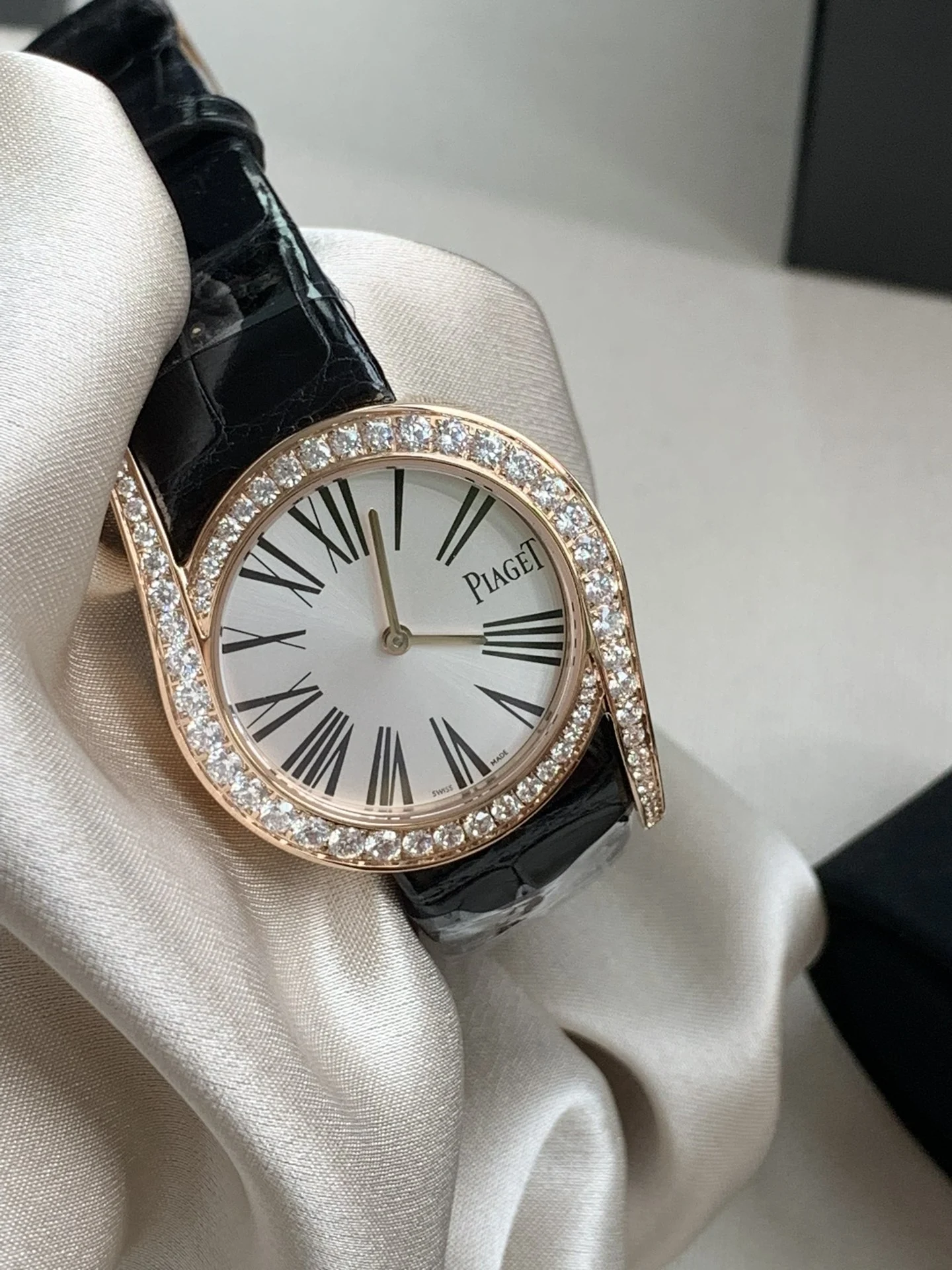 American alligator leather paired with rose gold, plus Roman β photographed off the sweep