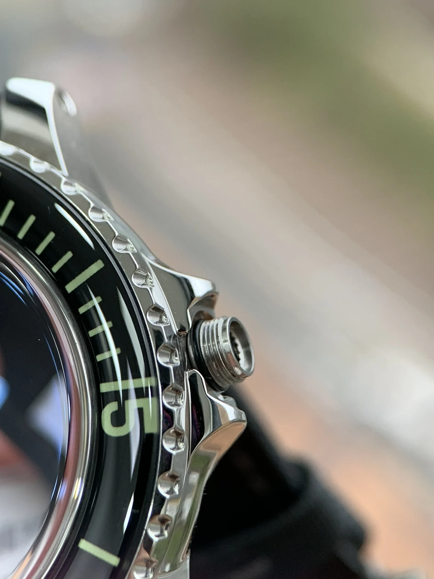 As a diving watch, the crown is the key to water resistance — photographed off the sweep