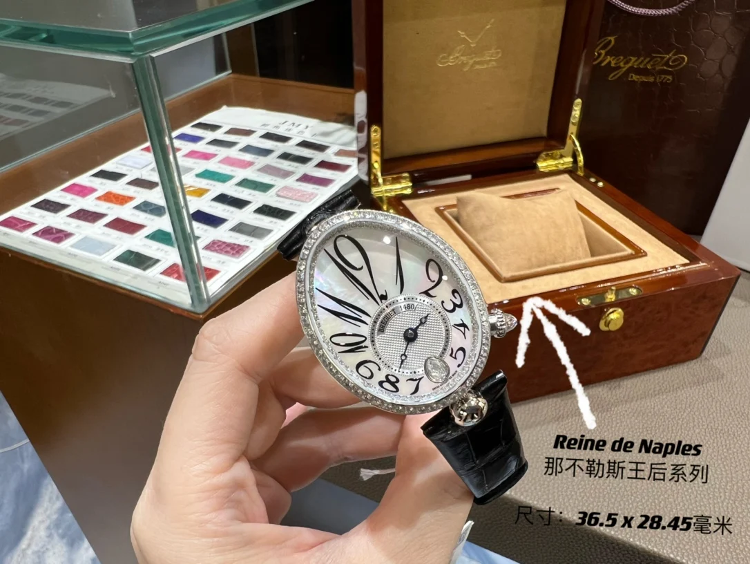 Breguet Reine de Naples Champagne Rose Gold Blue Dial 36.5 × 28.45mm — photographed off the sweep