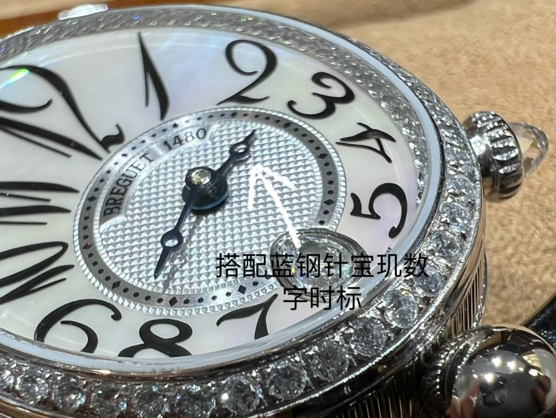 Breguet Reine de Naples Champagne Rose Gold Blue Dial 36.5 × 28.45mm — photographed off the sweep