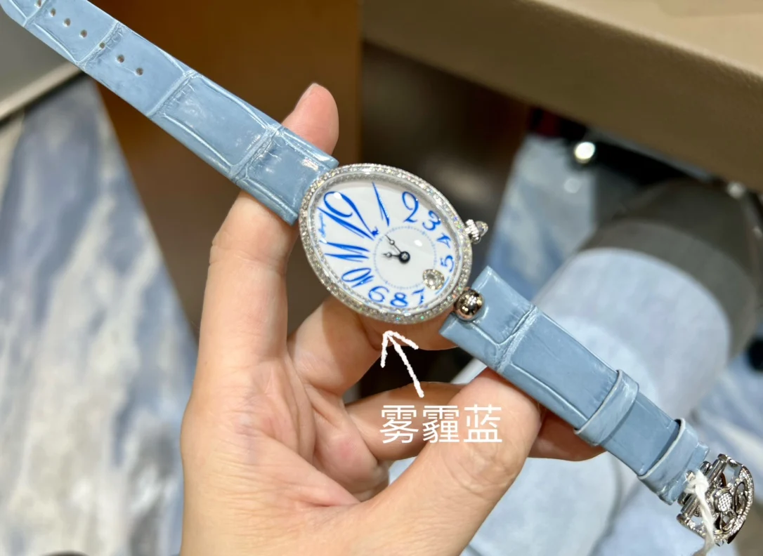 Breguet Reine de Naples Champagne Rose Gold Blue Dial 36.5 × 28.45mm — photographed off the sweep