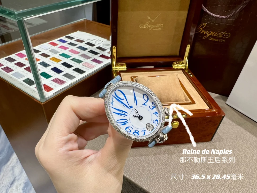 Breguet Reine de Naples Champagne Rose Gold Blue Dial 36.5 × 28.45mm — photographed off the sweep