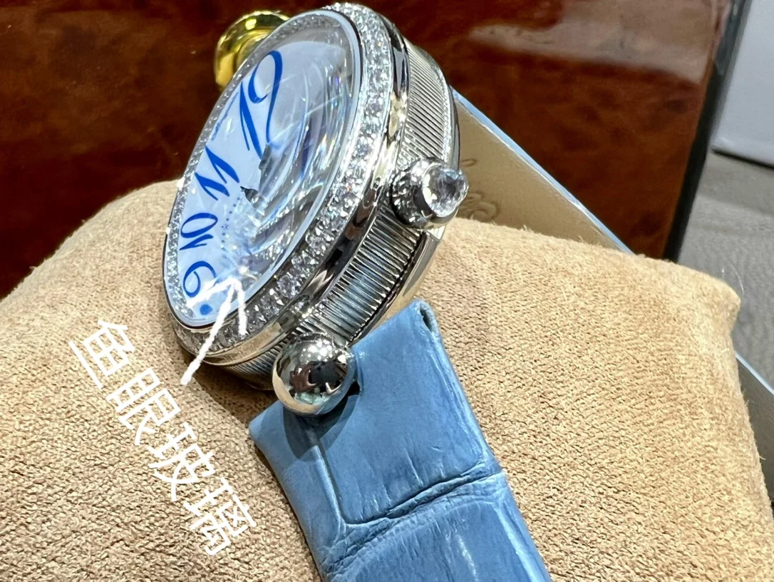 Breguet Reine de Naples Champagne Rose Gold Blue Dial 36.5 × 28.45mm — photographed off the sweep