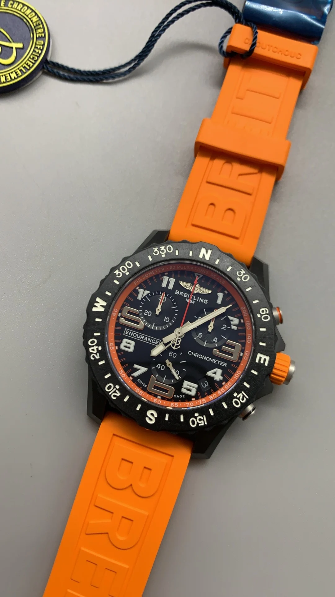Breitling Carbon Orange Dial — photographed off the sweep