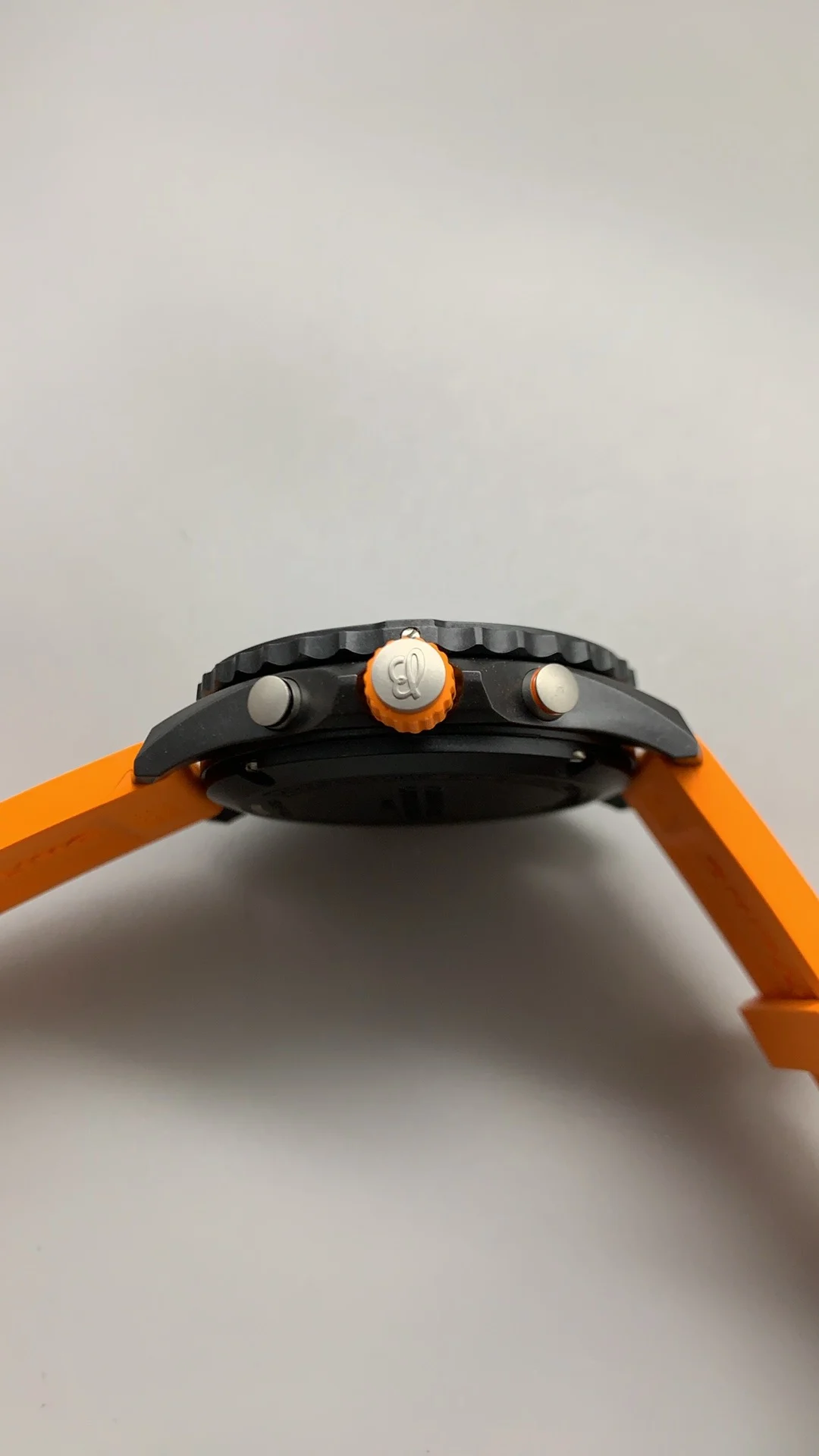 Breitling Carbon Orange Dial — photographed off the sweep