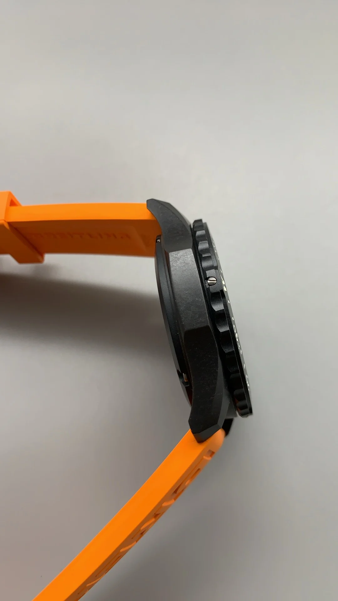 Breitling Carbon Orange Dial — photographed off the sweep