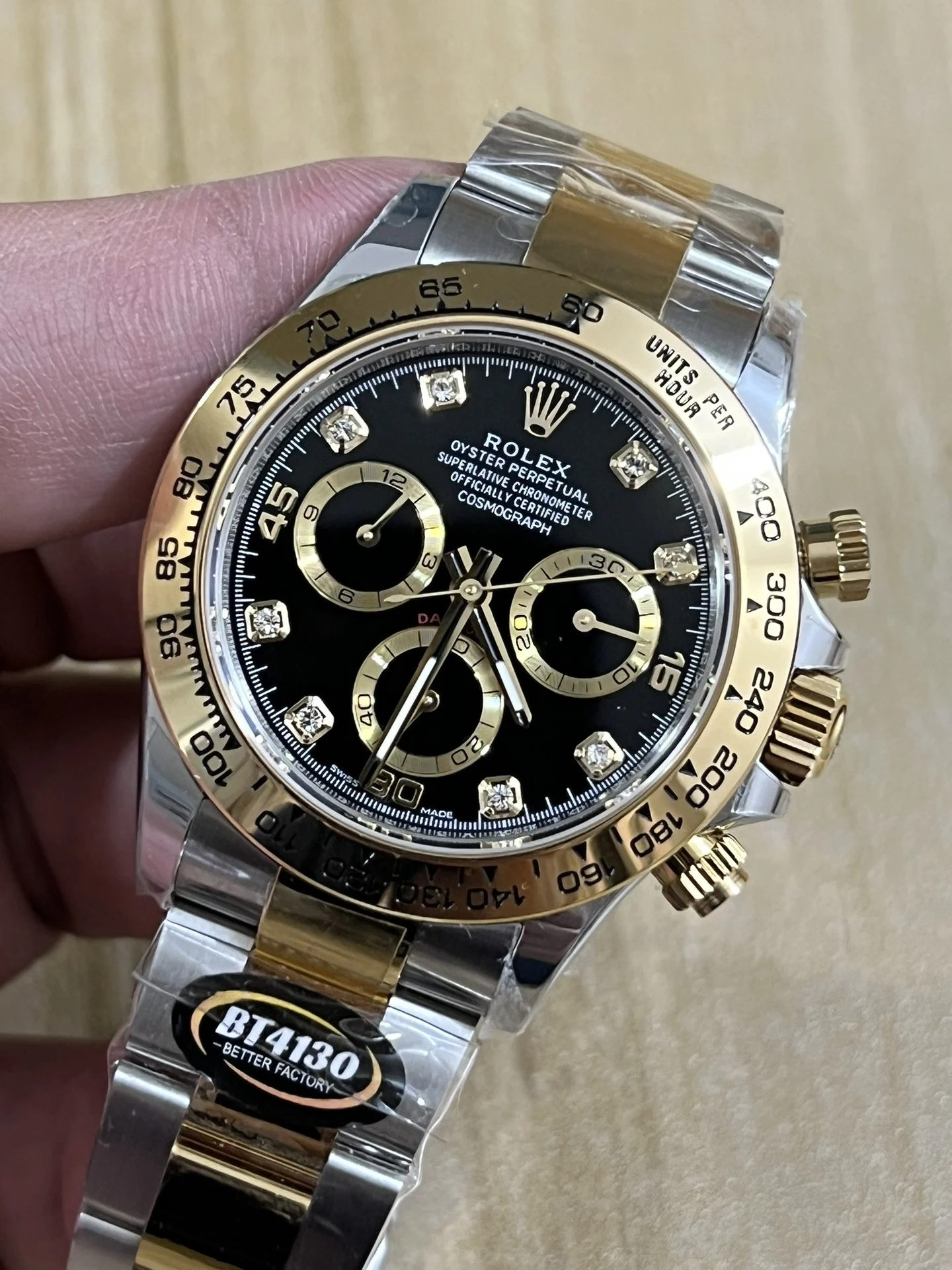 BT4130 two-tone steel and gold, three-section spliced granules — photographed off the sweep