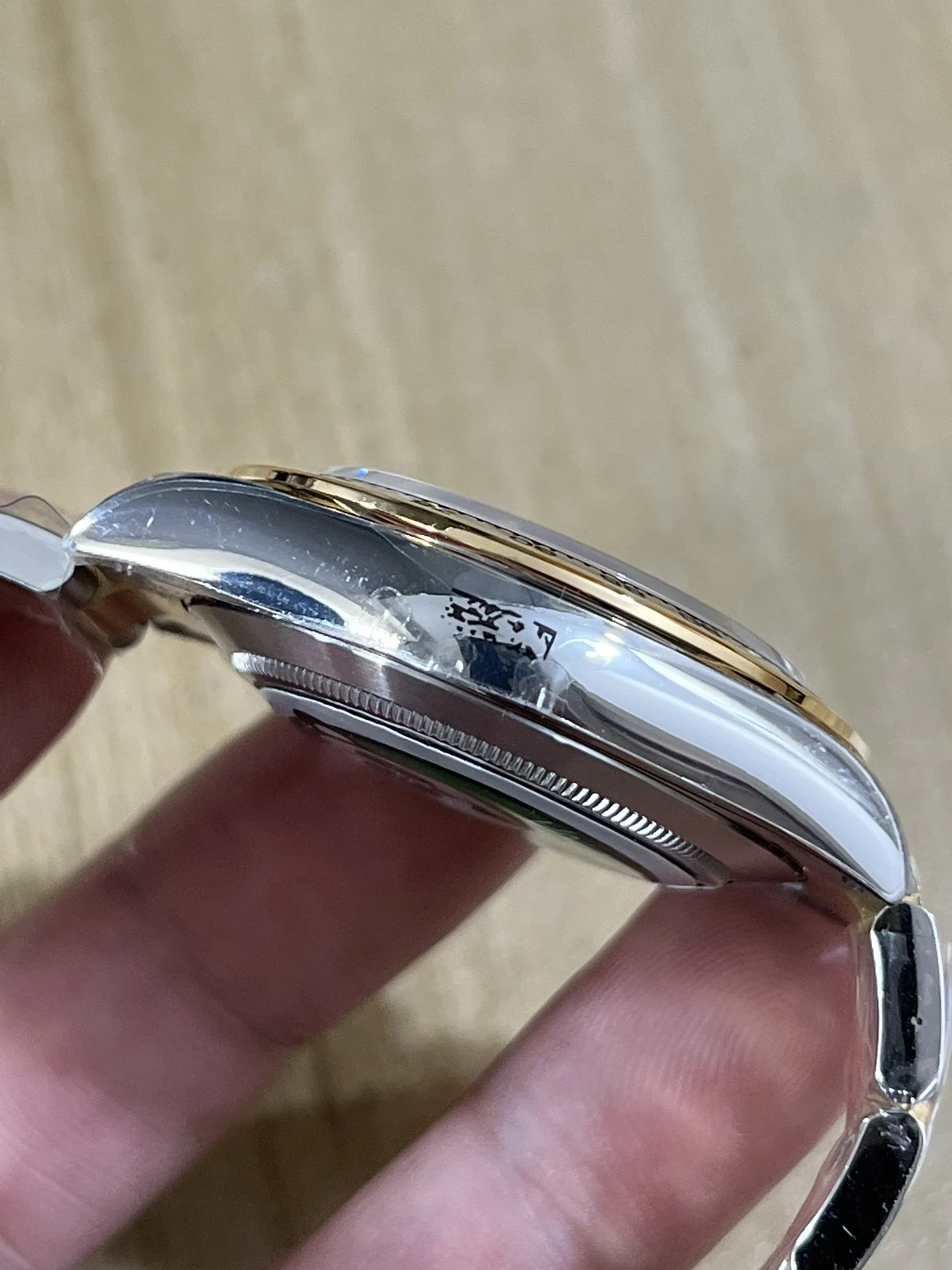 BT4130 two-tone steel and gold, three-section spliced granules — photographed off the sweep