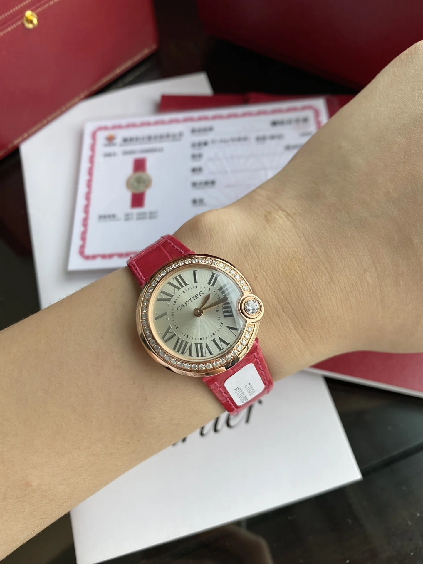 Cartier Ballon Bleu Rose Gold Red Dial — photographed off the sweep