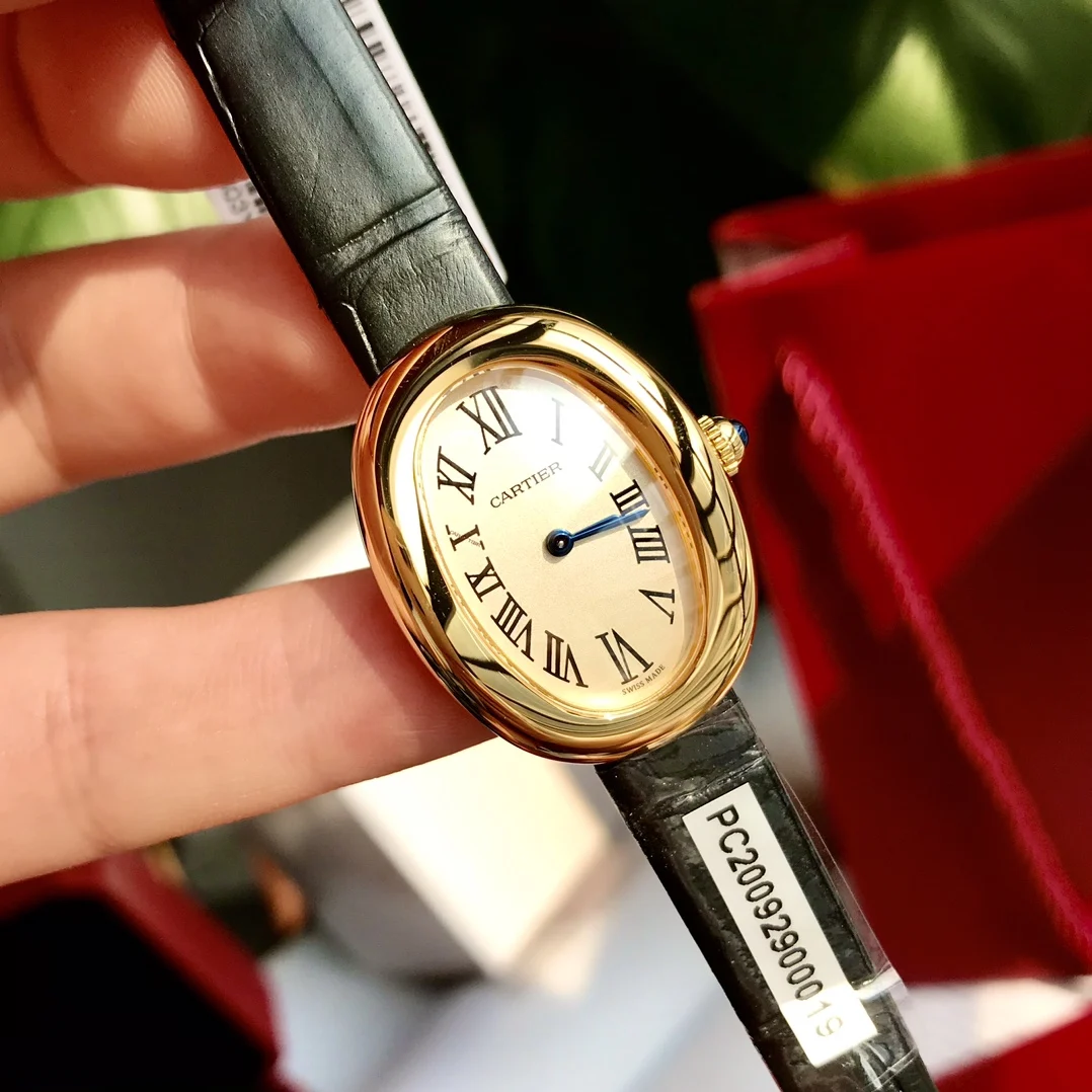 Cartier Ballon Bleu Yellow Gold Silver Dial 32 × 26mm — photographed off the sweep