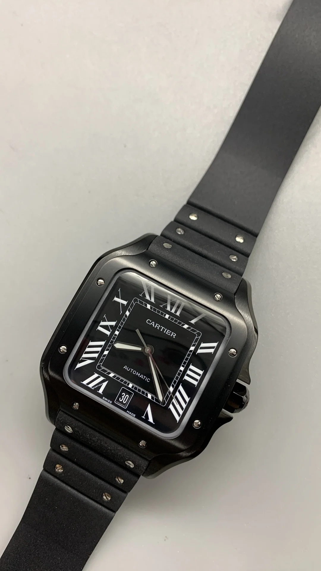 Cartier Santos Black Dial 40mm — photographed off the sweep