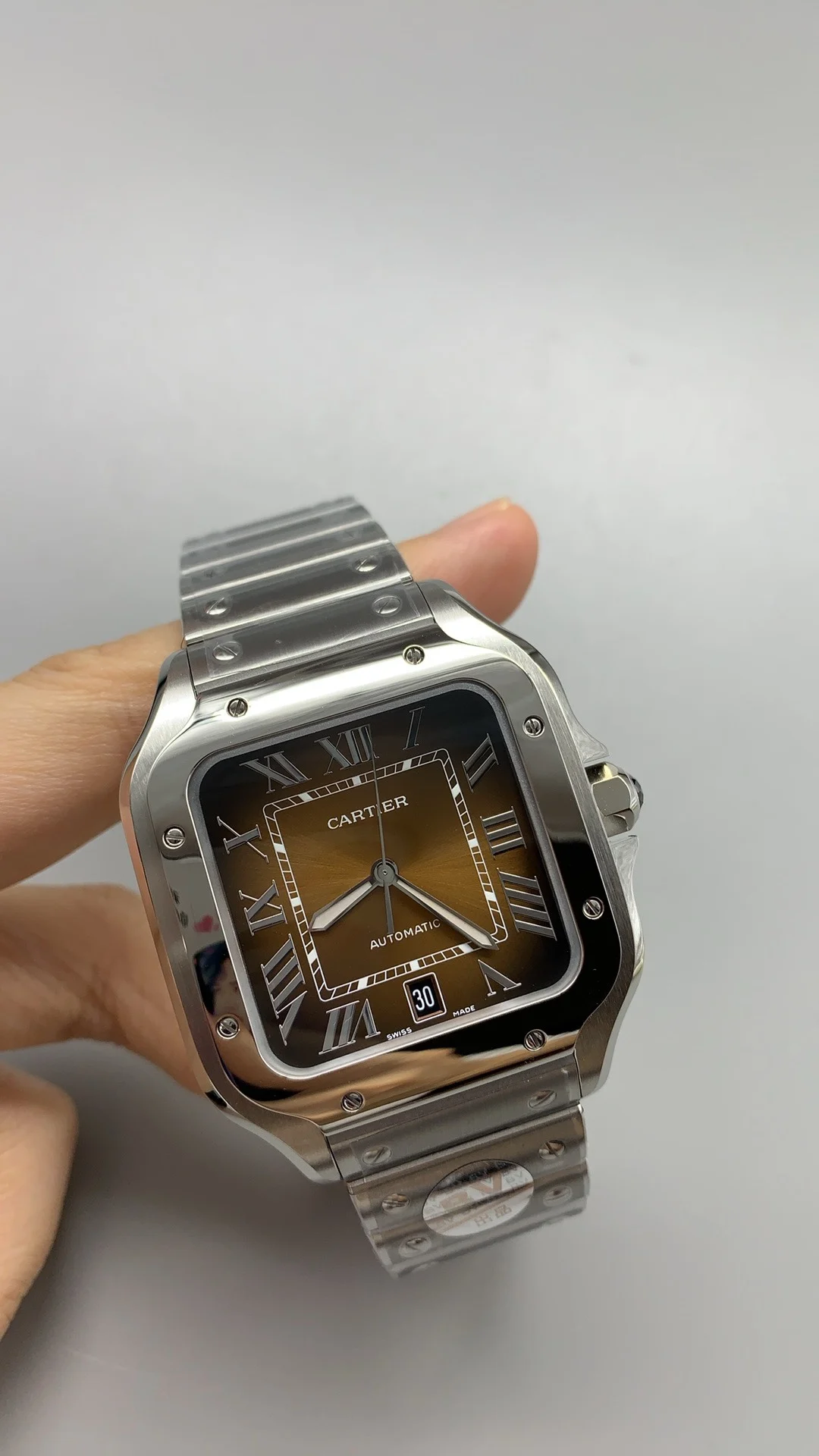 Cartier Santos Brown Dial 39.8mm — photographed off the sweep