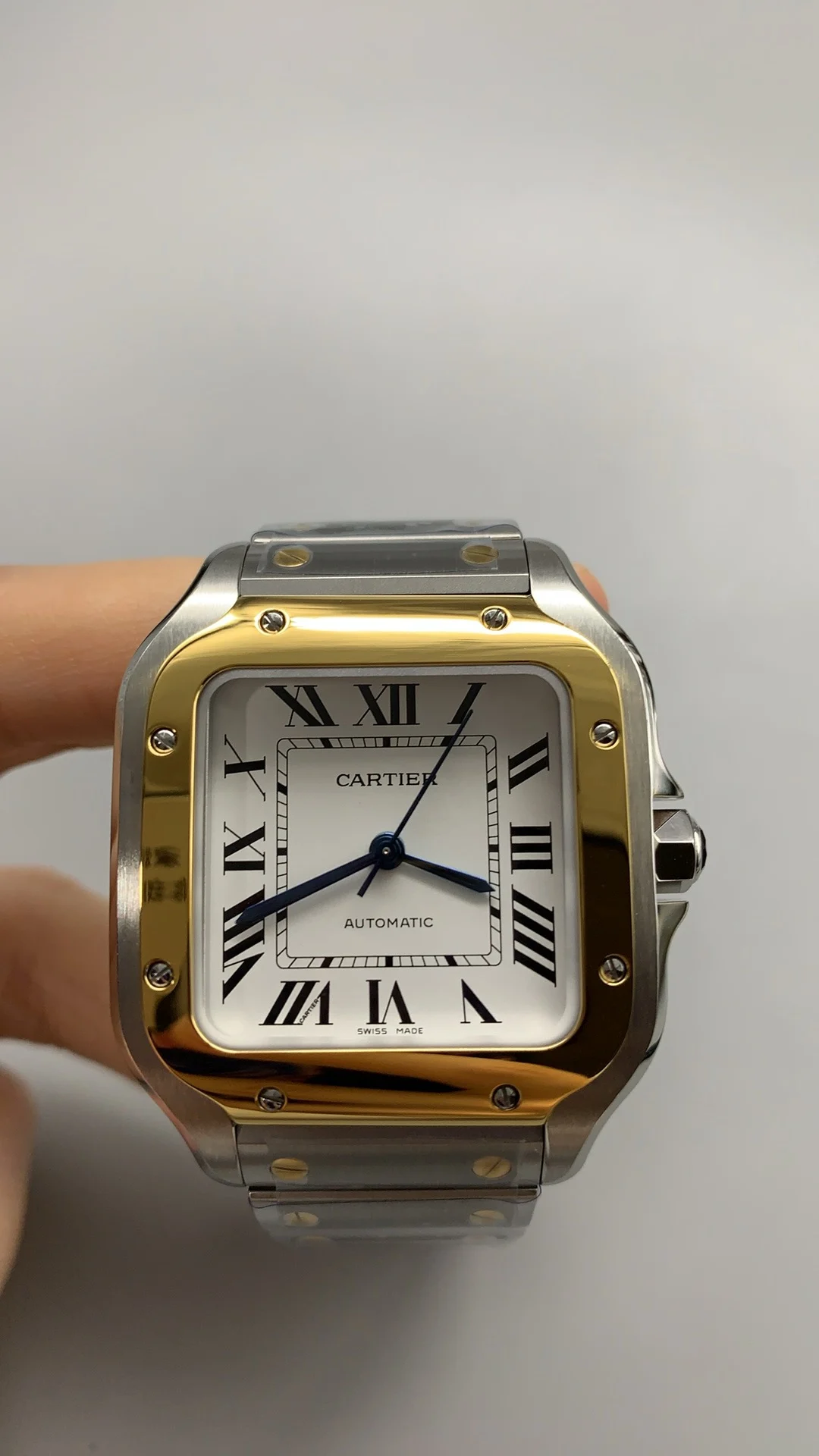 Cartier Santos Two-Tone White Dial 35mm — photographed off the sweep