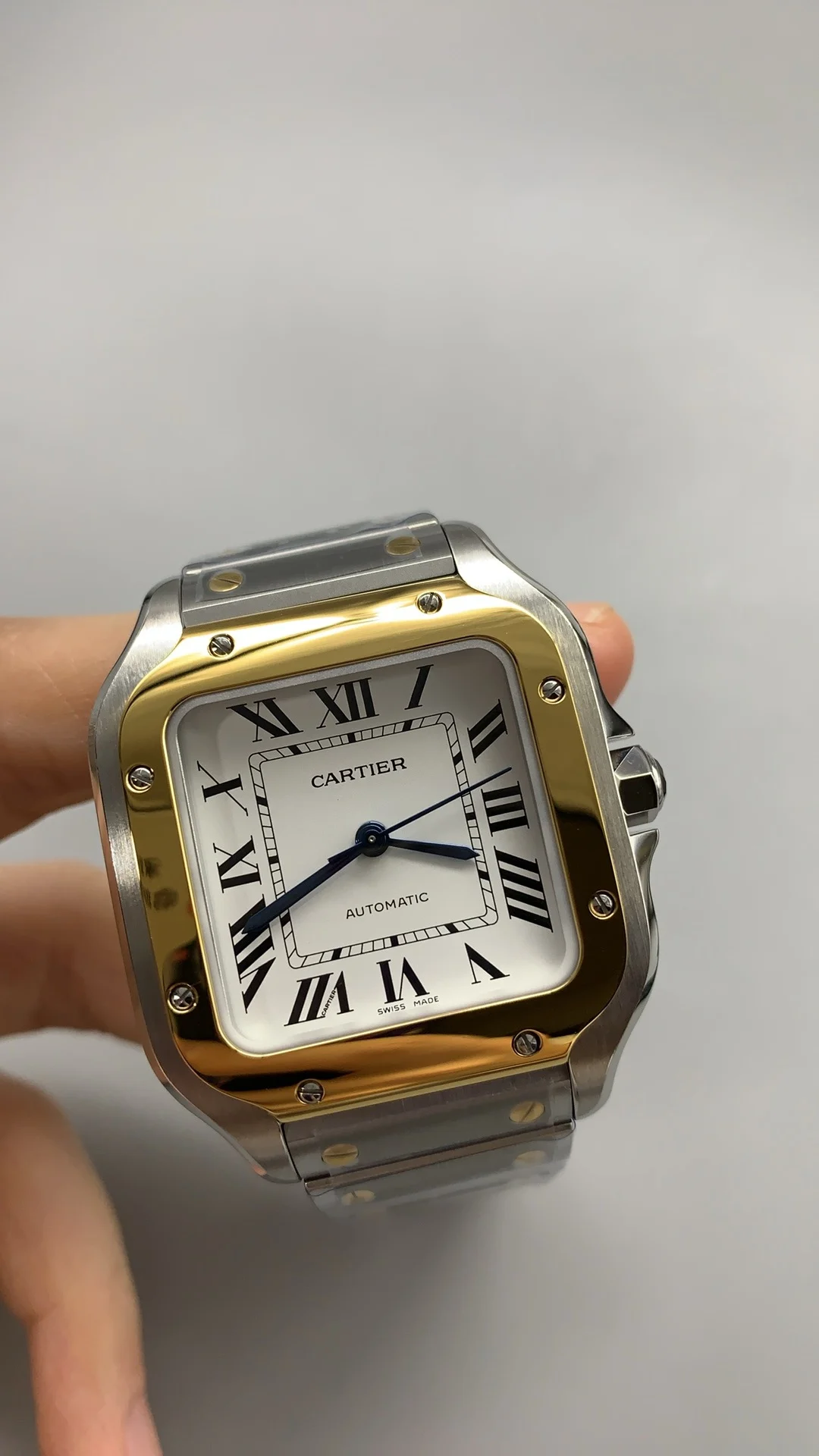 Cartier Santos Two-Tone White Dial 35mm — photographed off the sweep