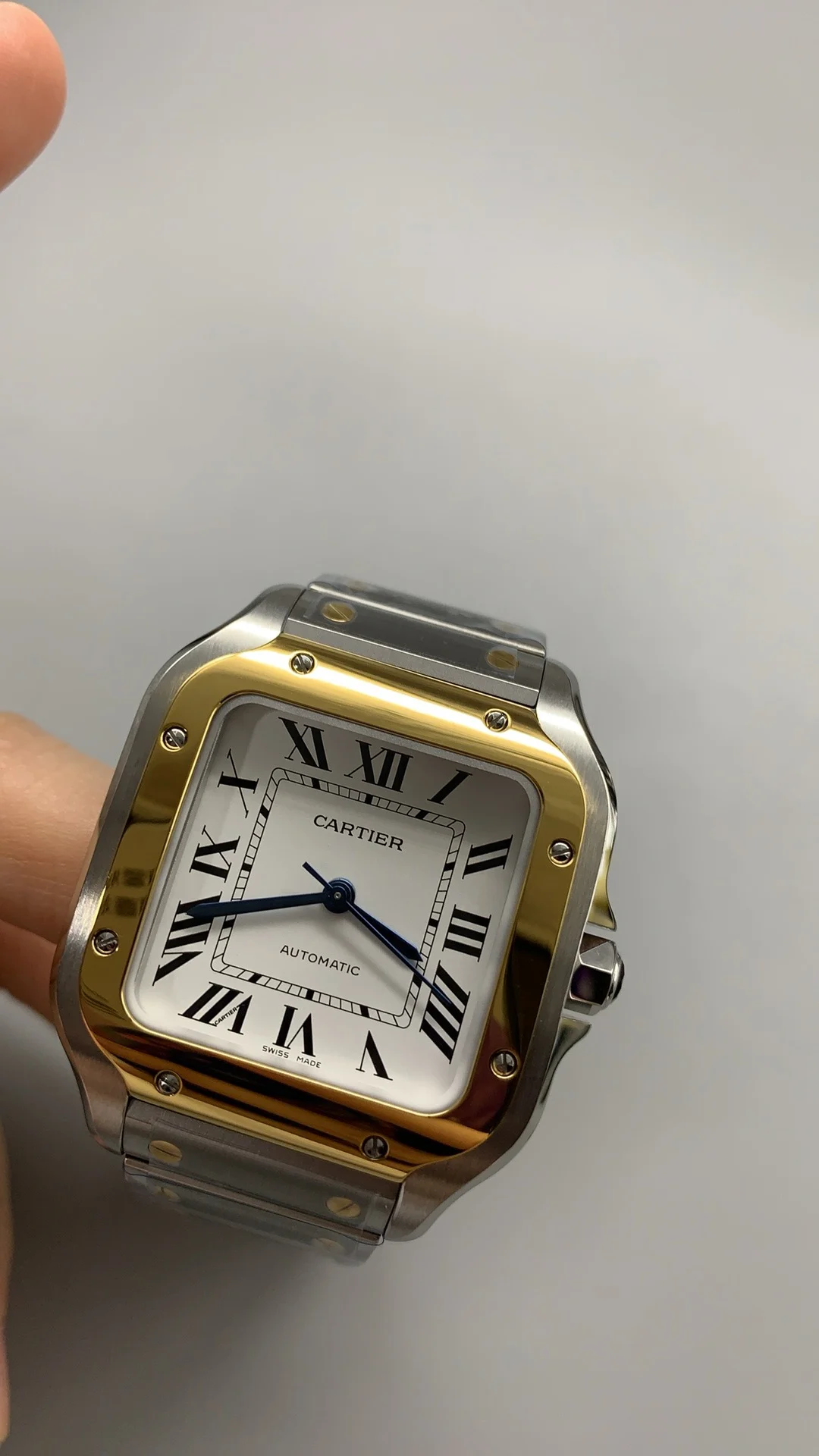 Cartier Santos Two-Tone White Dial 35mm — photographed off the sweep
