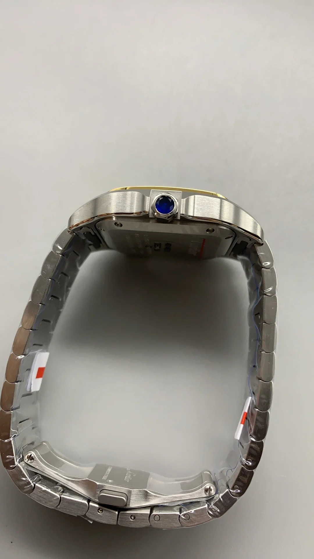 Cartier Santos Two-Tone White Dial 35mm — photographed off the sweep