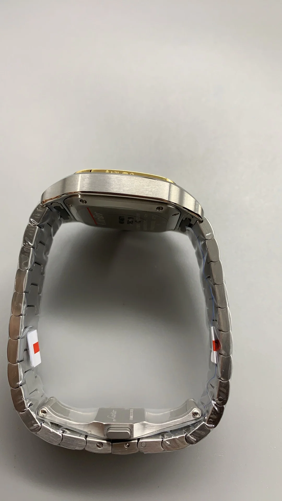 Cartier Santos Two-Tone White Dial 35mm — photographed off the sweep