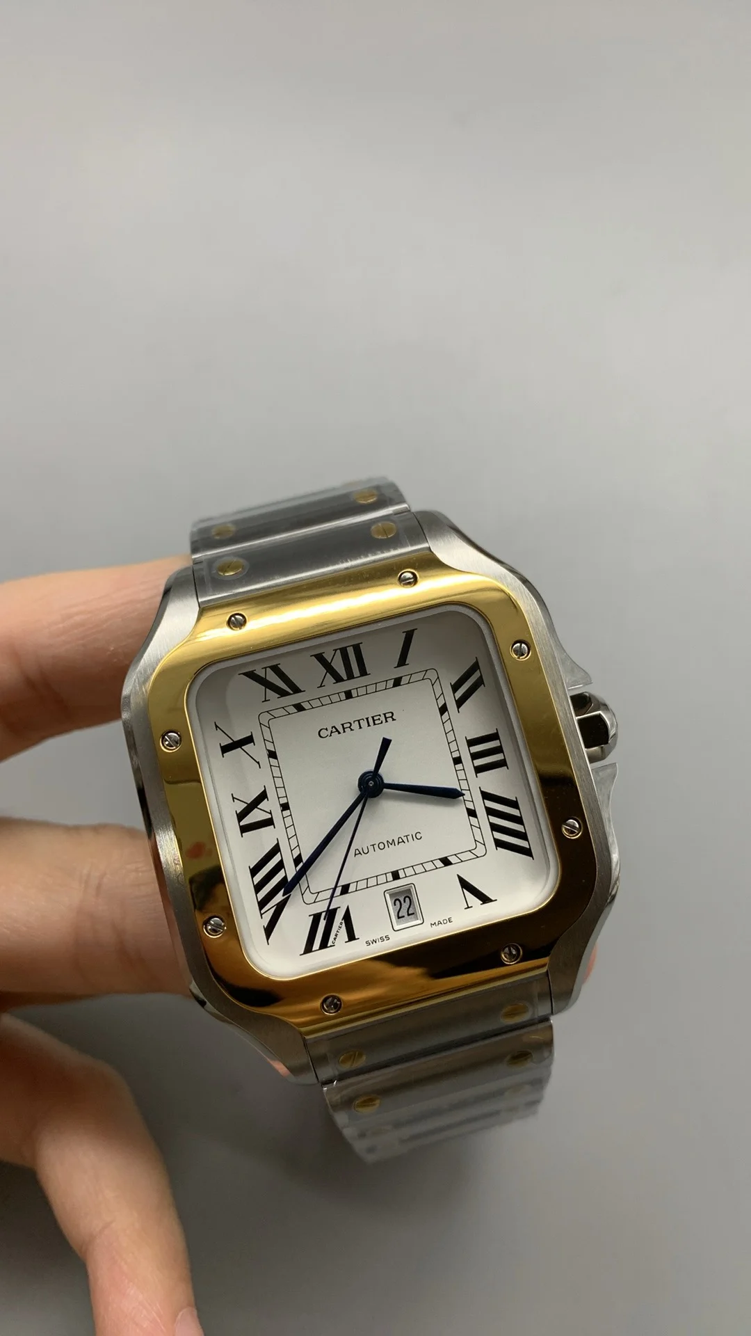 Cartier Santos Two-Tone White Dial 40mm — photographed off the sweep