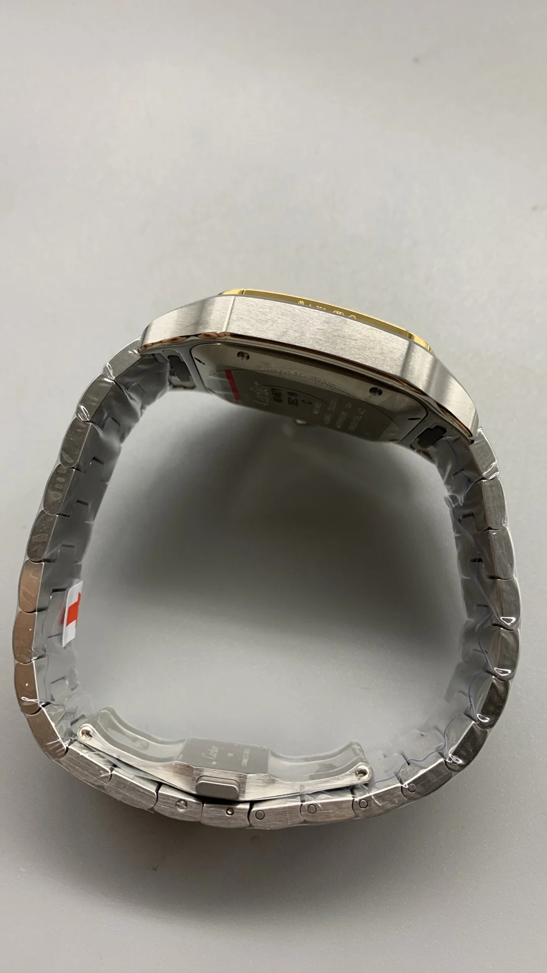 Cartier Santos Two-Tone White Dial 40mm — photographed off the sweep