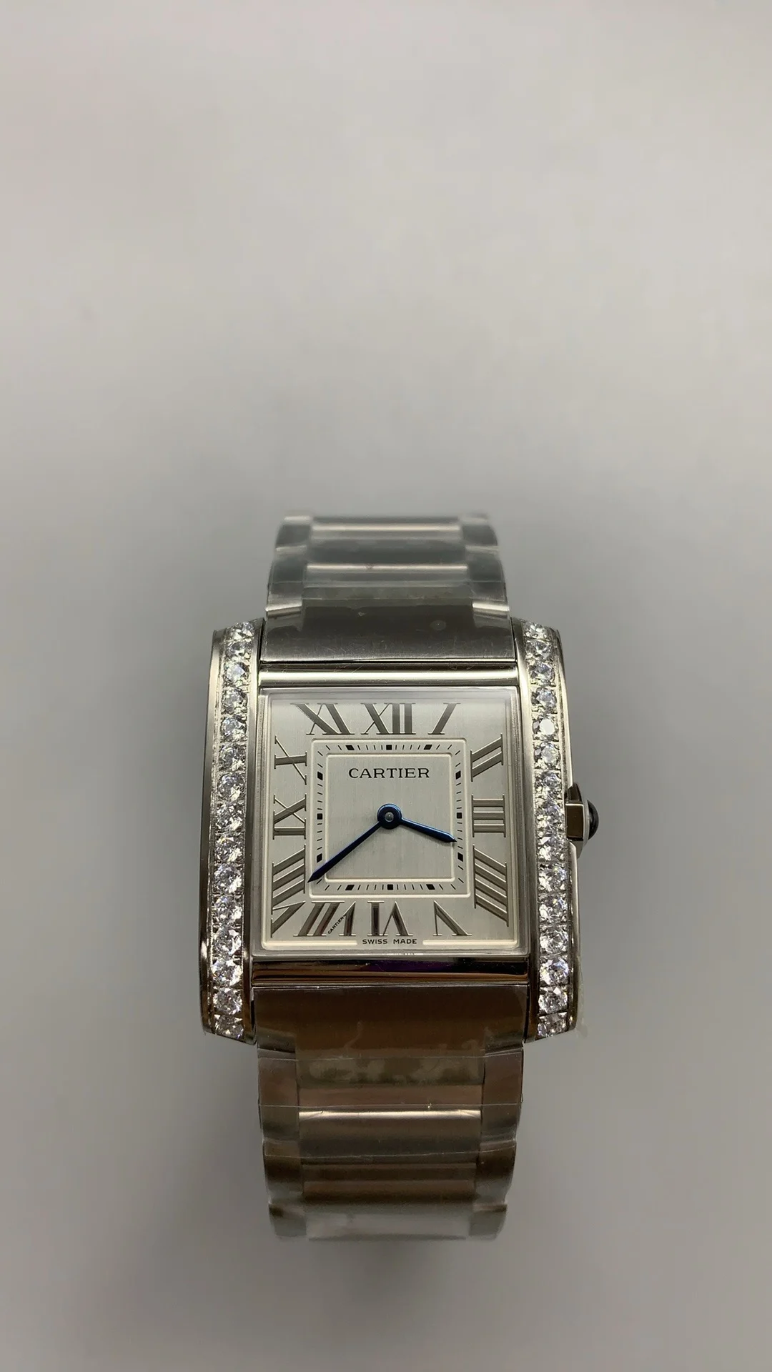 Cartier Tank 32 × 27mm — photographed off the sweep