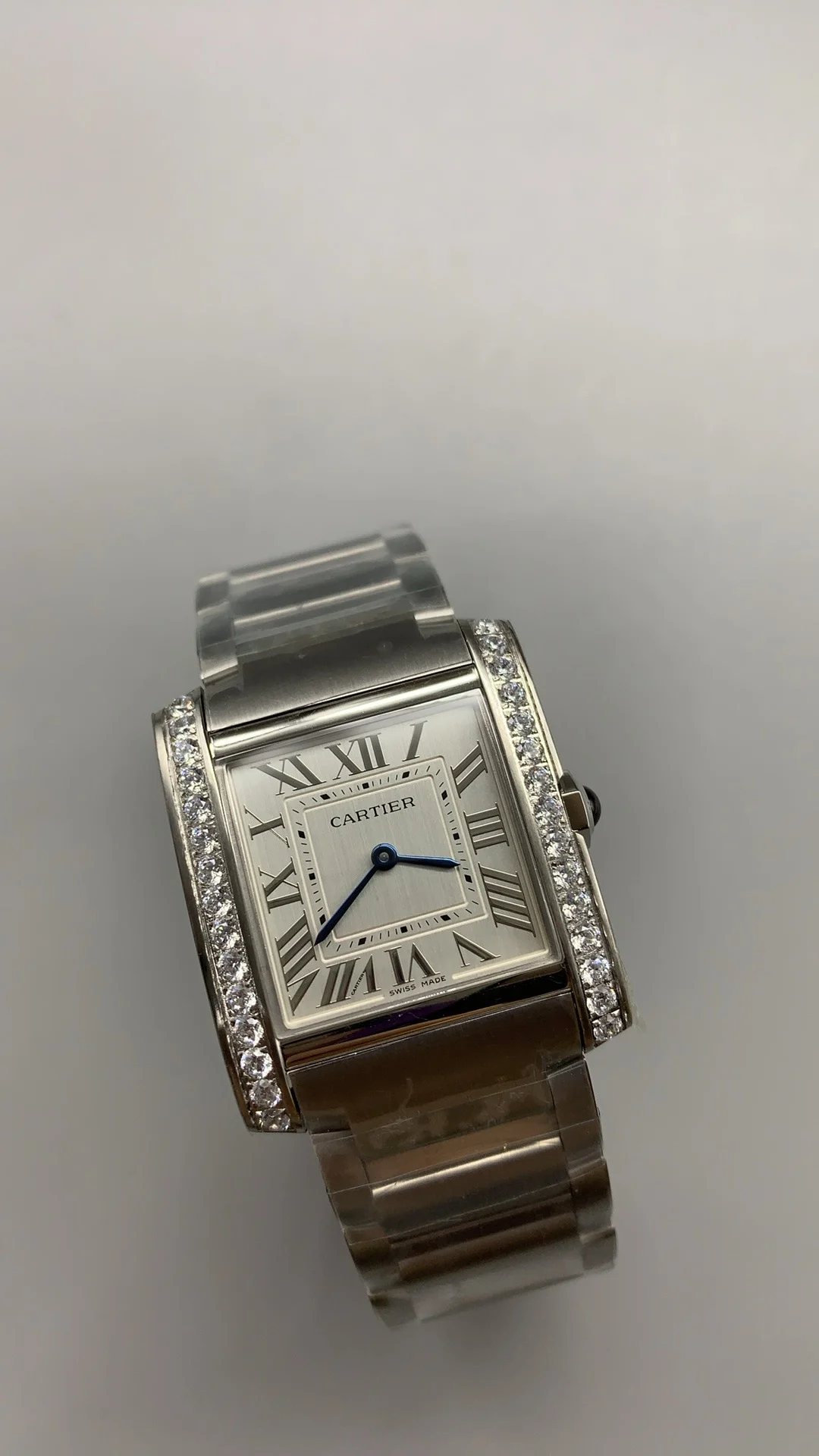 Cartier Tank 32 × 27mm — photographed off the sweep
