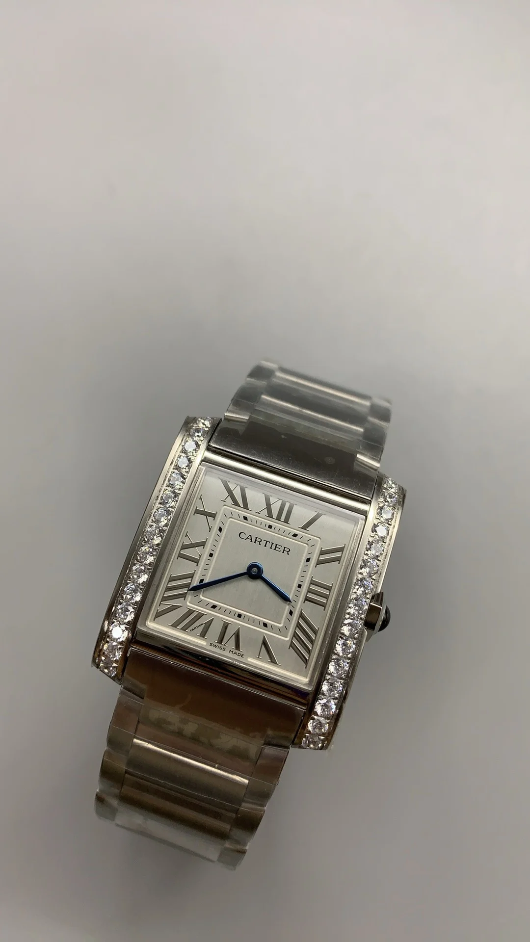 Cartier Tank 32 × 27mm — photographed off the sweep