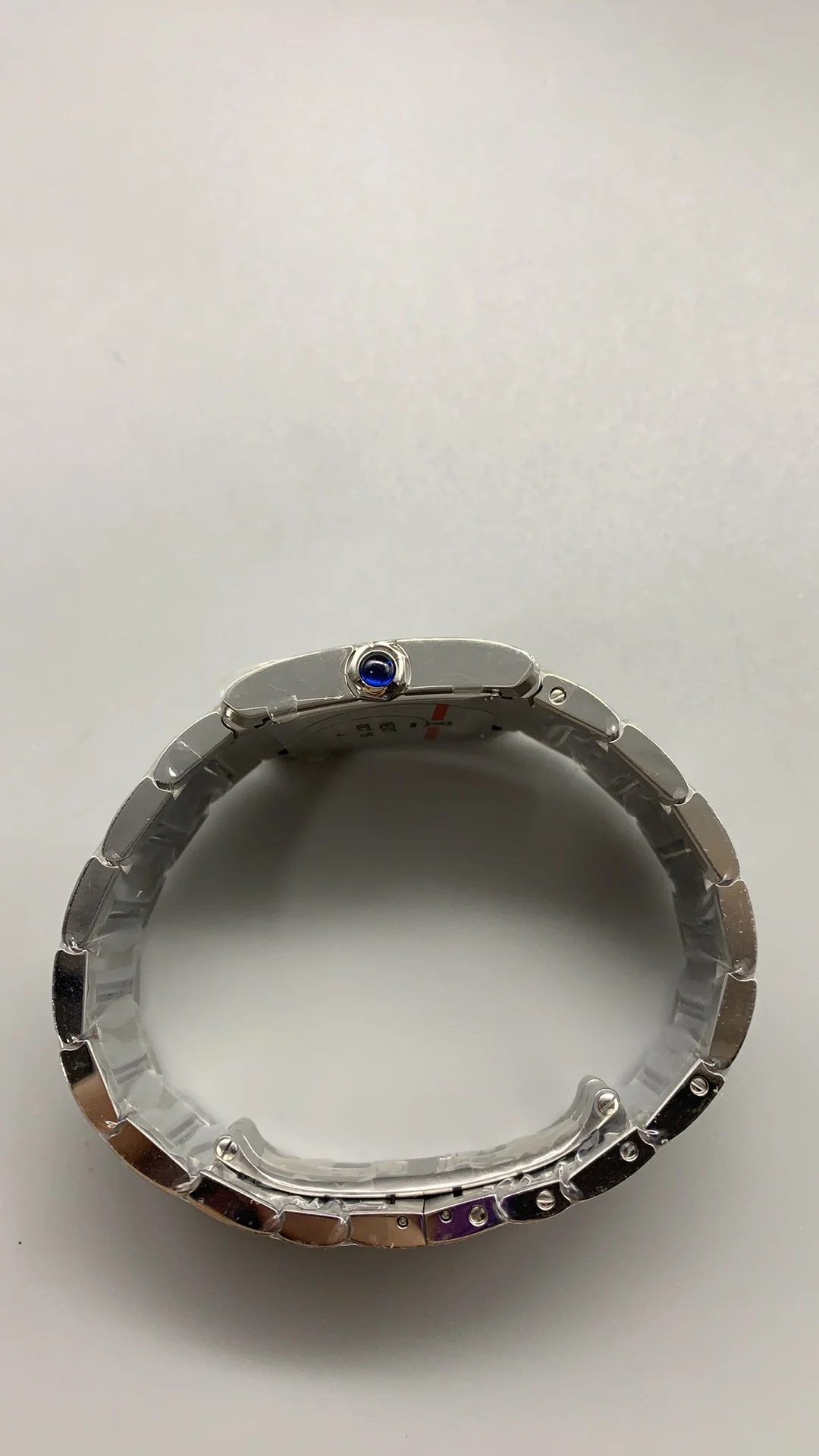 Cartier Tank 32 × 27mm — photographed off the sweep