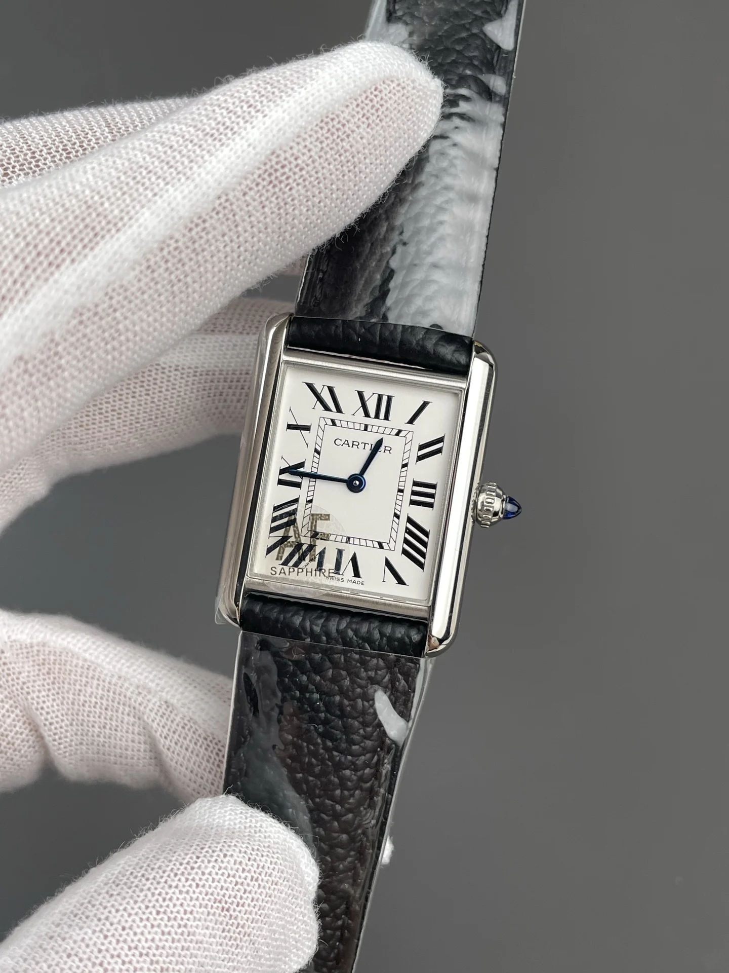 Cartier Tank 33.7 × 25.5mm — photographed off the sweep