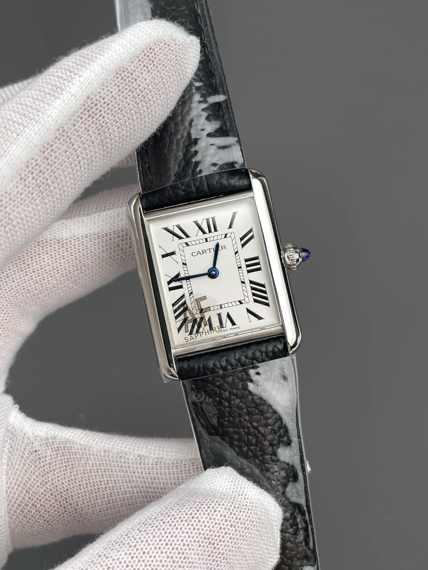 Cartier Tank 33.7 × 25.5mm — photographed off the sweep