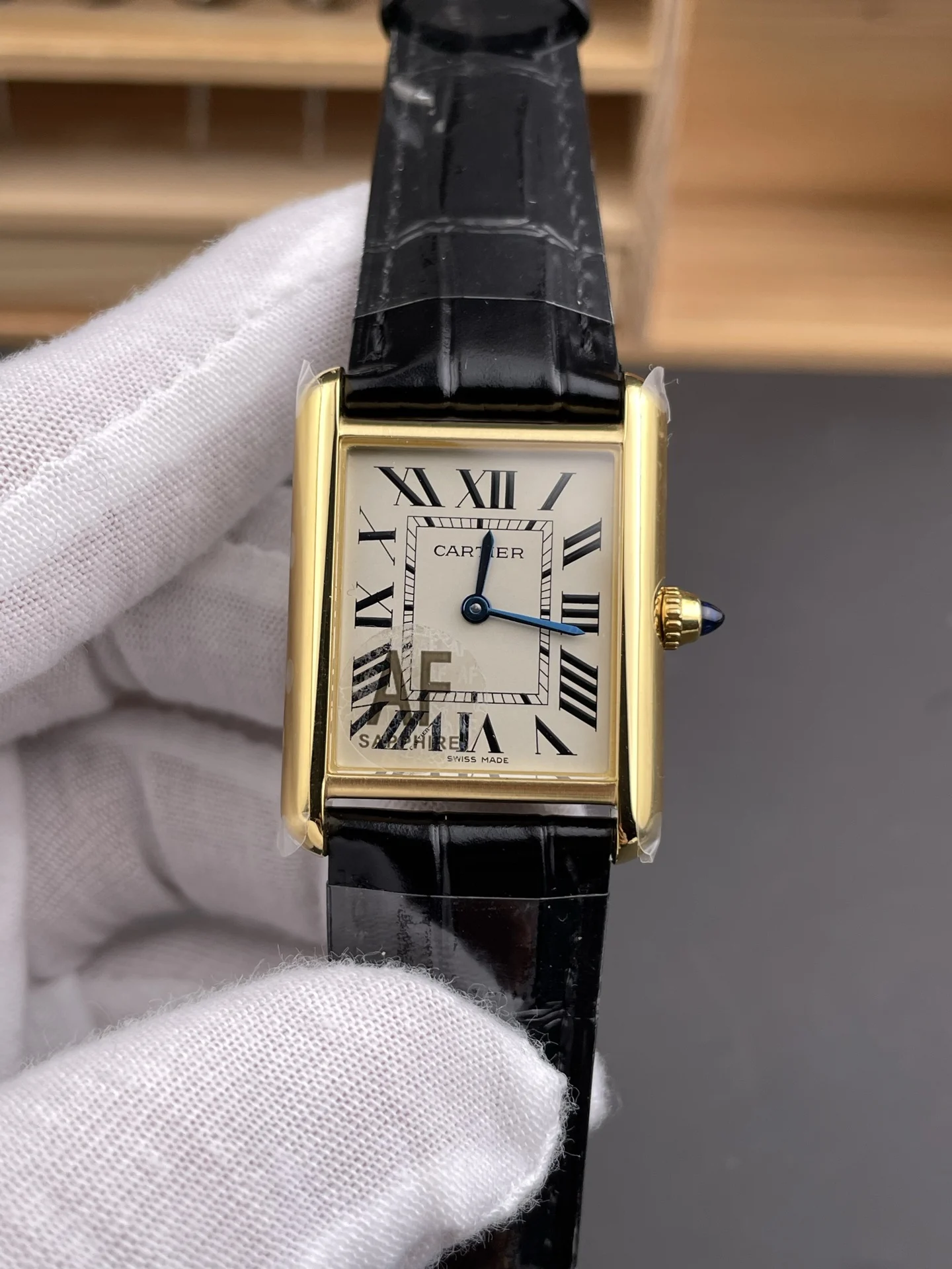 Cartier Tank 33.7 × 25.5mm — photographed off the sweep