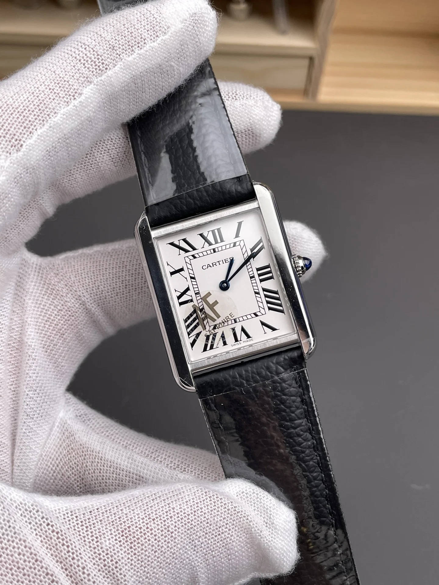 Cartier Tank 34.8 × 27.4mm — photographed off the sweep