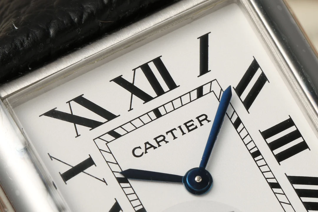 Cartier Tank Steel Blue Dial 29.5mm — photographed off the sweep