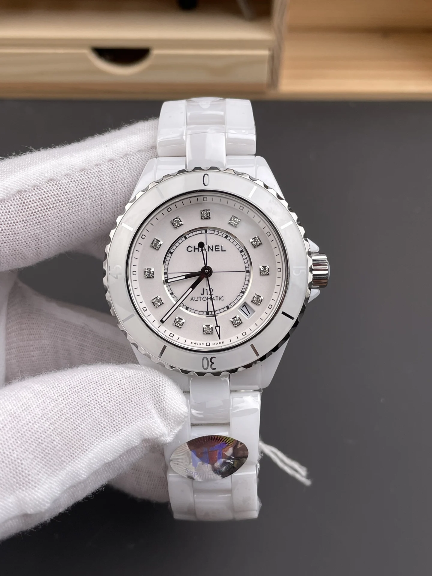 Chanel J12 White Dial — photographed off the sweep
