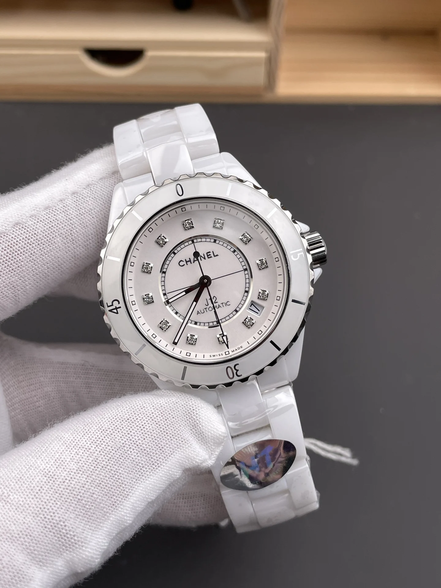 Chanel J12 White Dial — photographed off the sweep