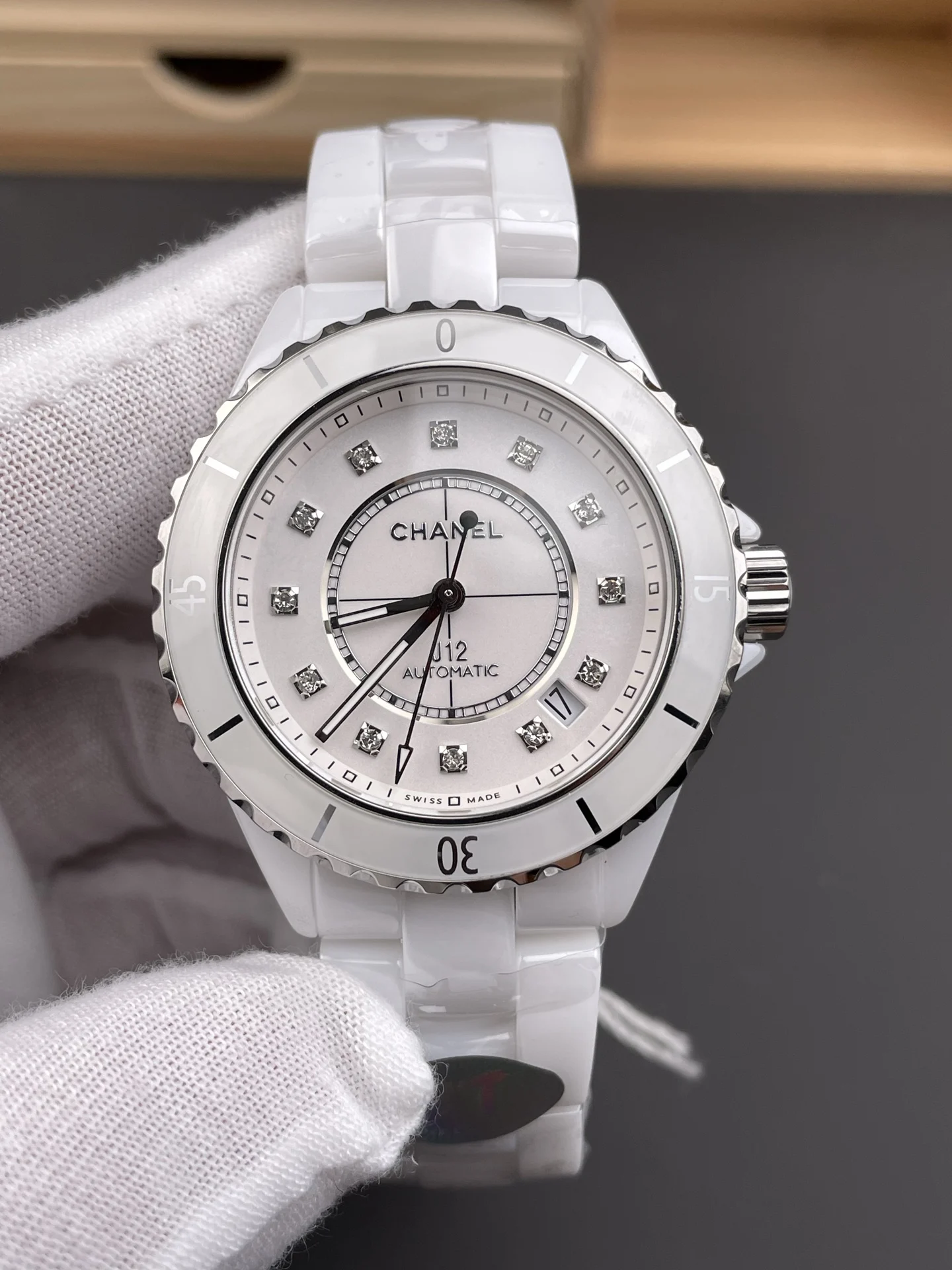 Chanel J12 White Dial — photographed off the sweep