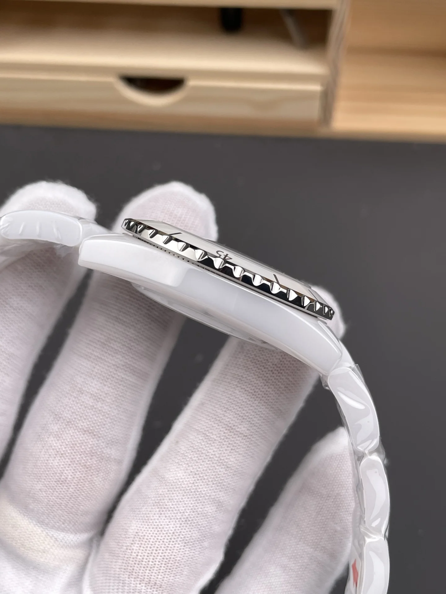Chanel J12 White Dial — photographed off the sweep