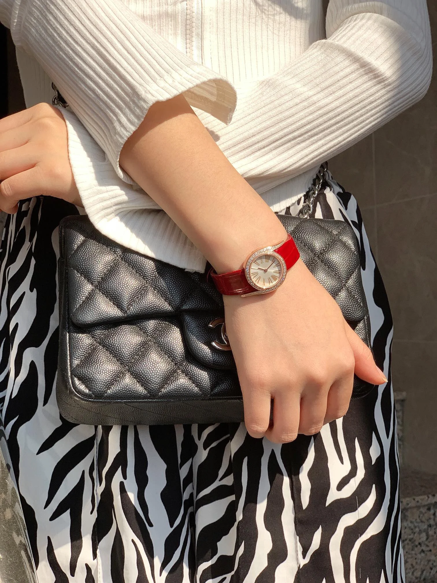 Chic red alligator leather strap — photographed off the sweep