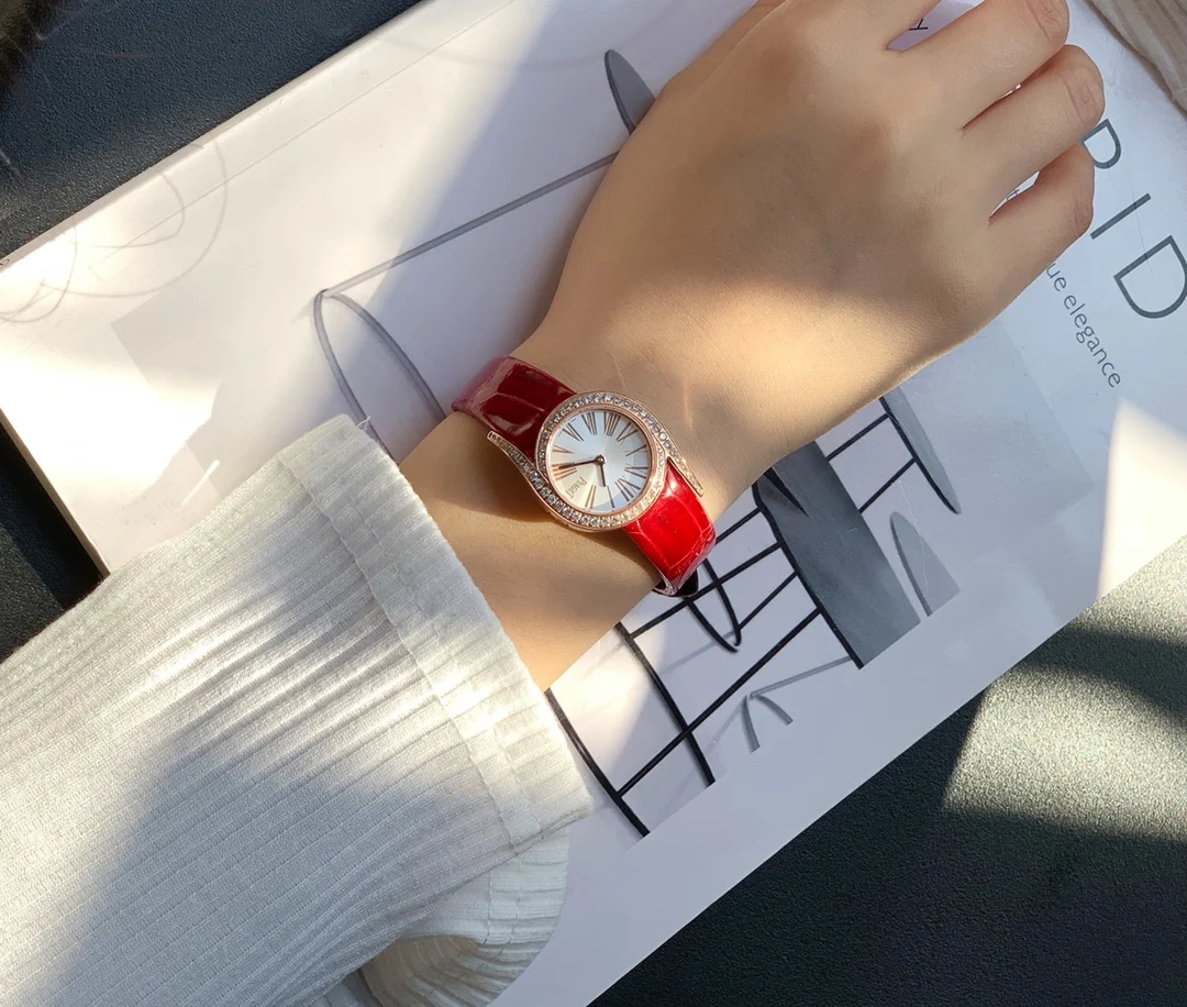 Chic red alligator leather strap — photographed off the sweep