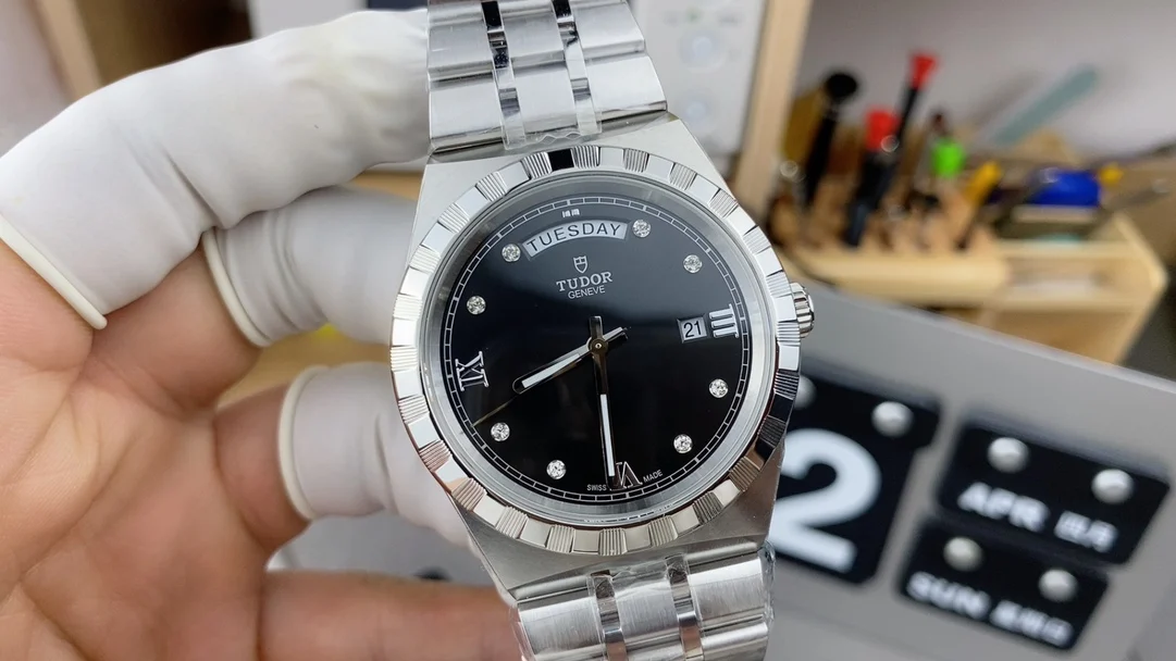 day-date display Tudor men's watch — photographed off the sweep
