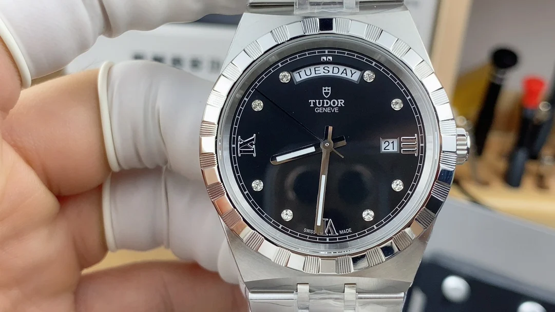 day-date display Tudor men's watch — photographed off the sweep