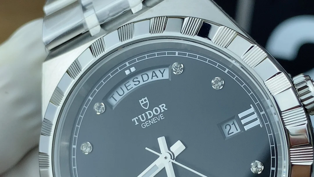 day-date display Tudor men's watch — photographed off the sweep