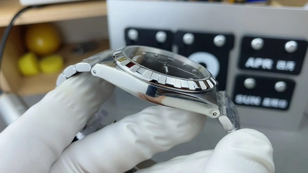 day-date display Tudor men's watch — photographed off the sweep