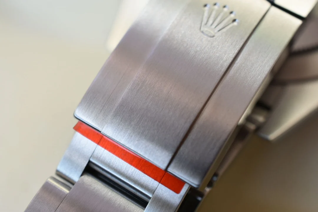 Exclusive 904 stainless steel bracelet; most watches on — photographed off the sweep