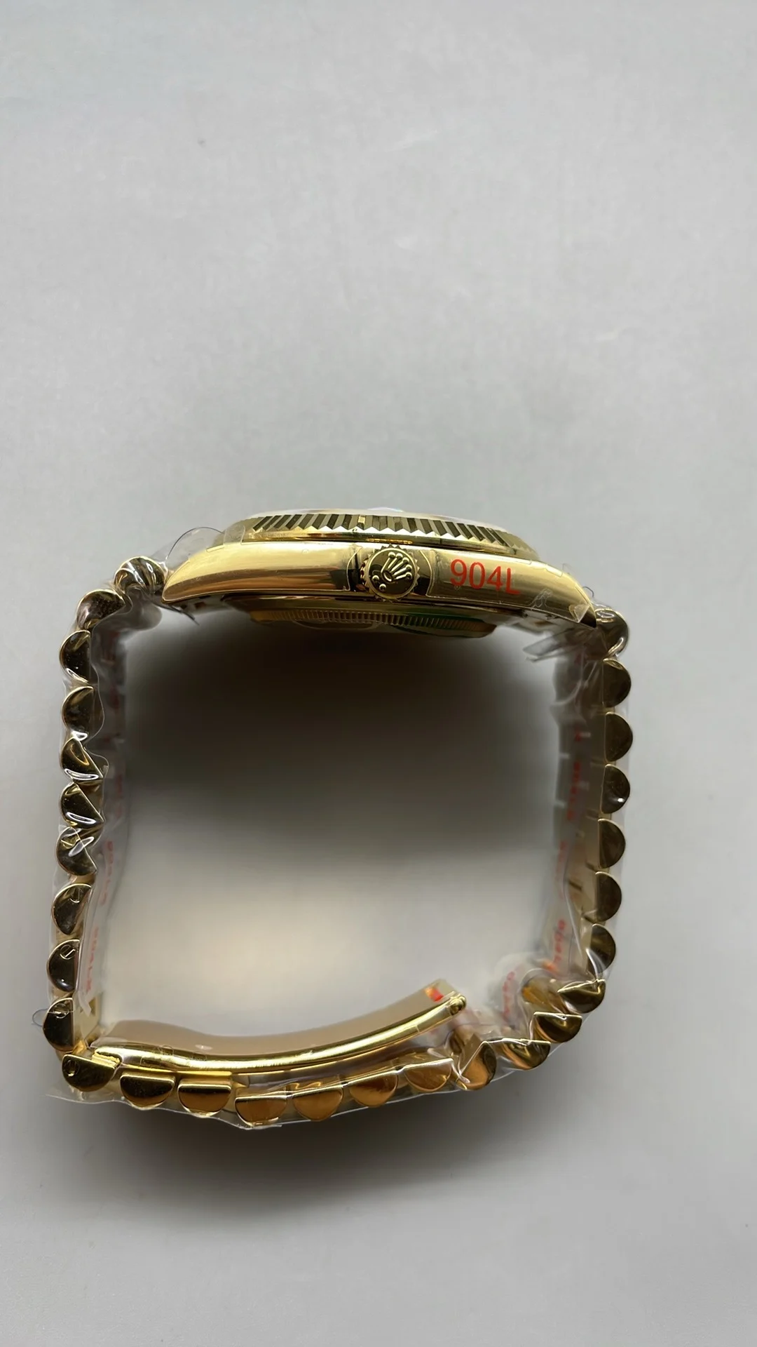 GMF, 40mm, gold ceramic, white Roman numerals, weighted version — photographed off the sweep