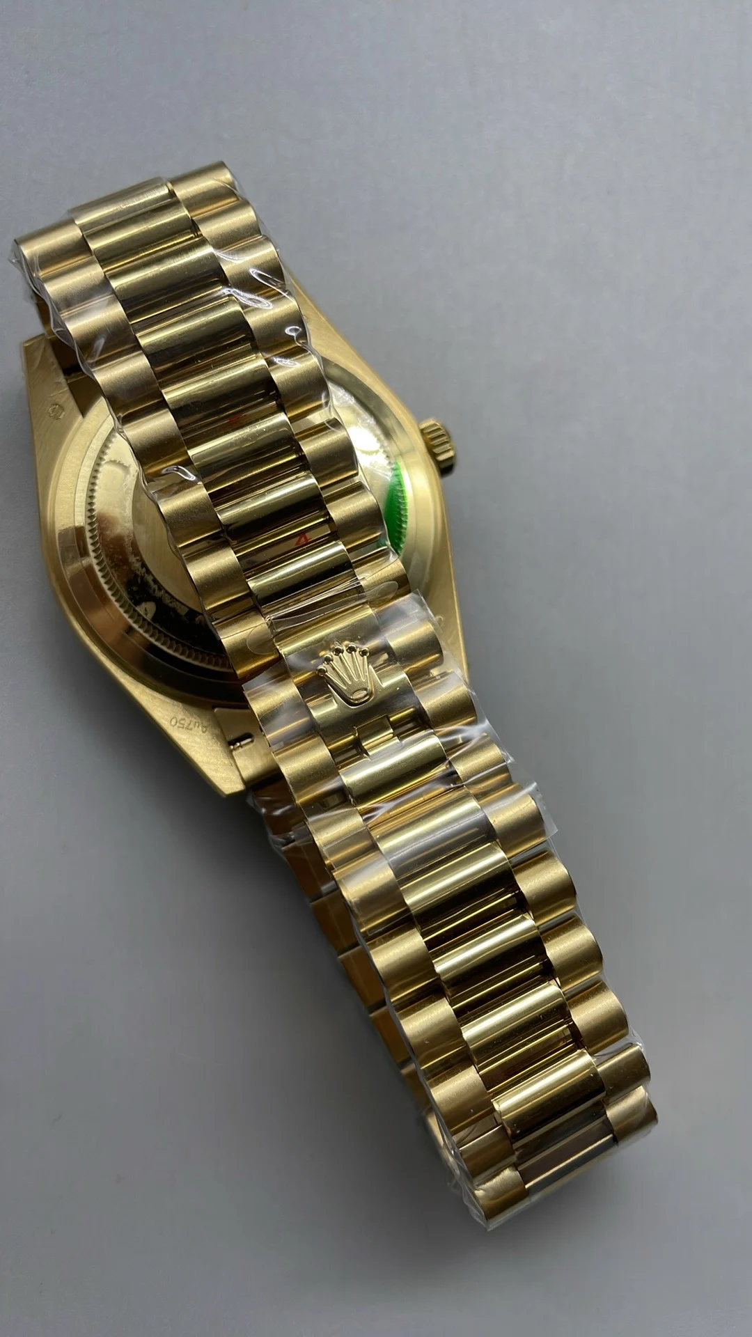 GMF, 40mm, gold ceramic, white Roman numerals, weighted version — photographed off the sweep