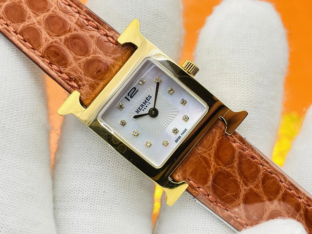 Hermès Steel Red Dial — photographed off the sweep