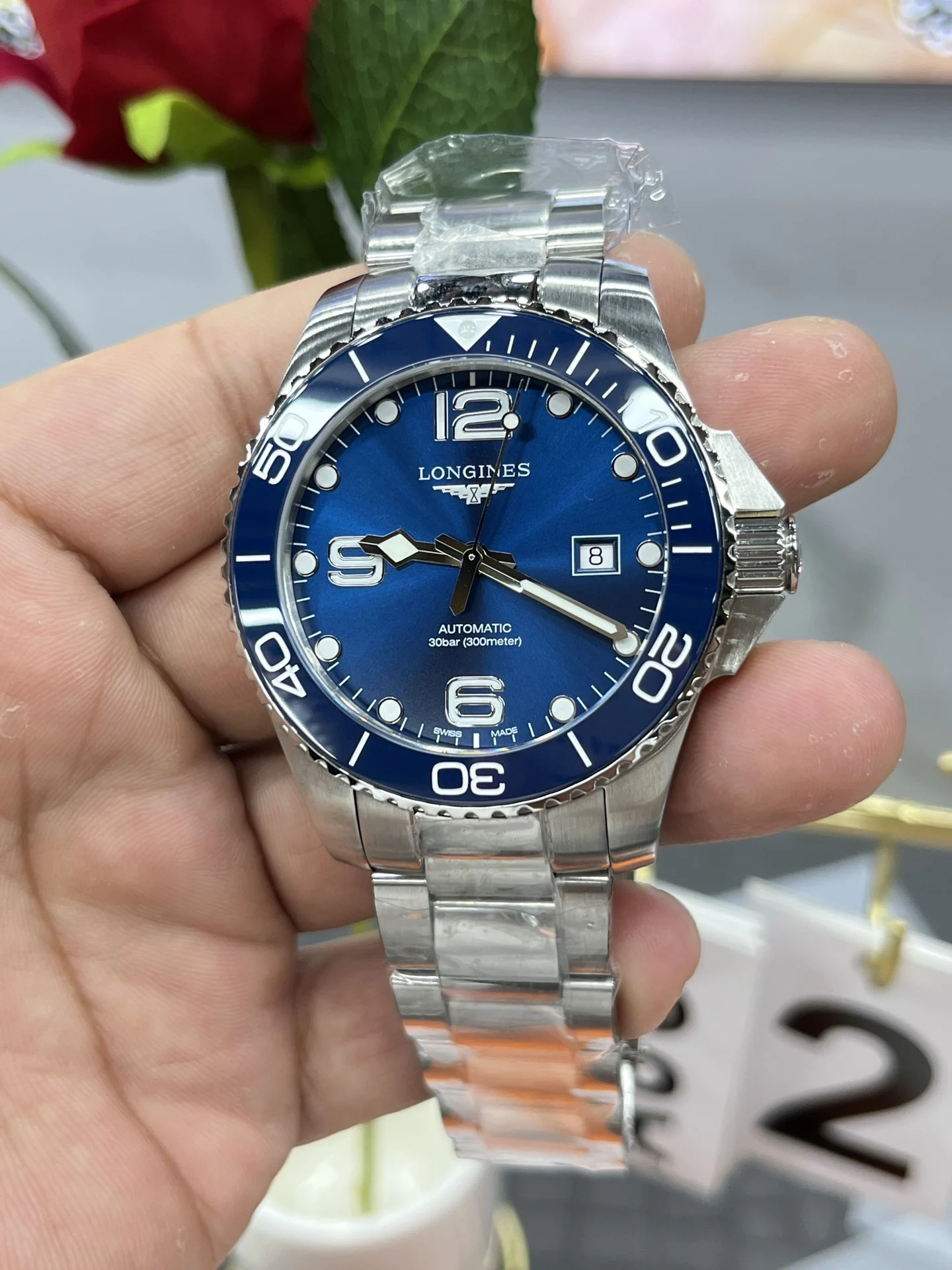 Longines Conquest 43mm — photographed off the sweep