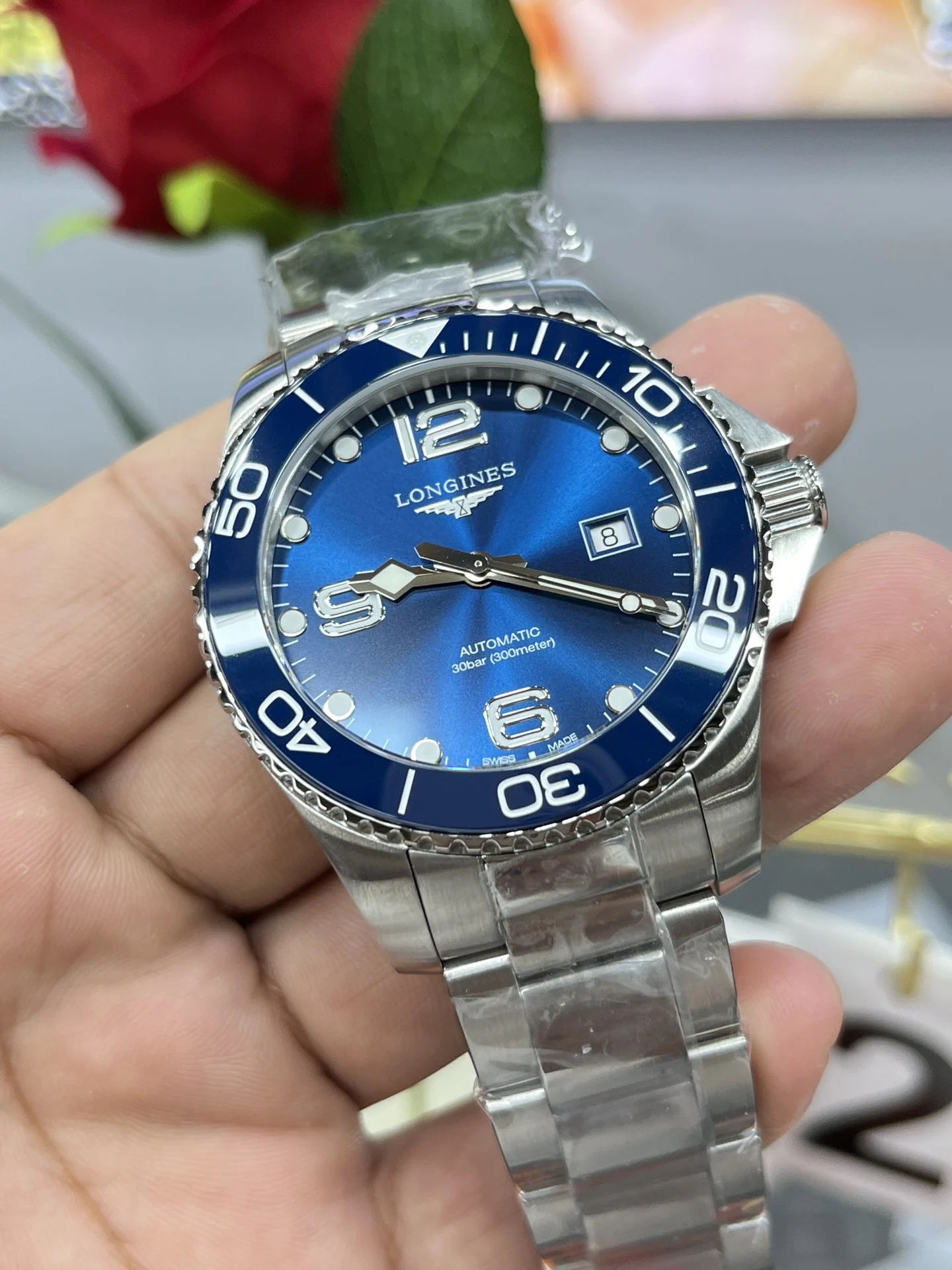 Longines Conquest 43mm — photographed off the sweep